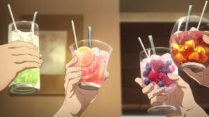 4 hands of different people holding up a cocktail to cheers one another.