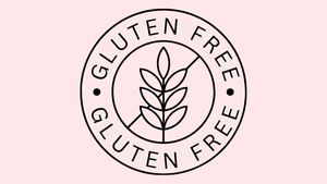 soft pink background with a wheat leaf in the middle and a line through it. around the inner circle is text reading "GLUTEN FREE"