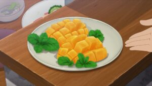 Mango cut in halves and scored with cubes for easy eating. Decorated with fresh herbs on a white plate that's resting on a wooden table. Anime style art.