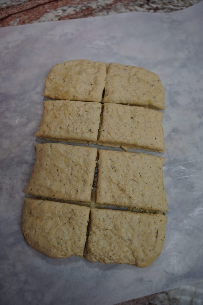 autumn seasoned biscuit dough rolled out and cut into 8 sections.