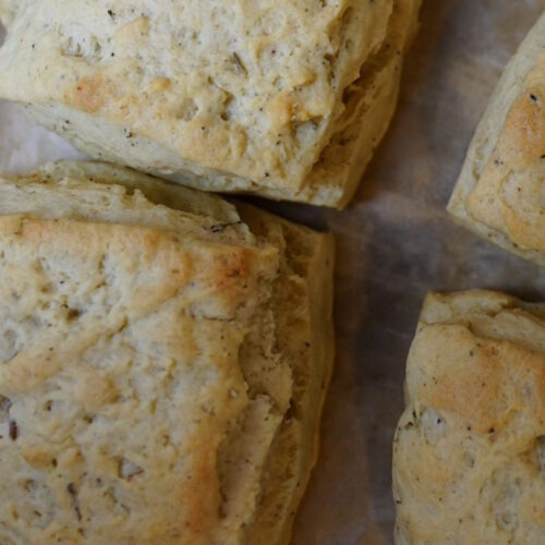 autumn seasoned biscuits on parchment paper lined baking sheet.