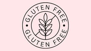 soft pink background with a wheat leaf in the middle and a line through it. around the inner circle is text reading "GLUTEN FREE"